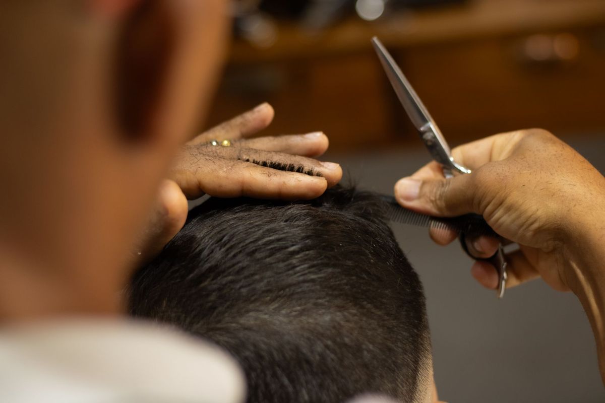 Barber working closely on a classic haircut
